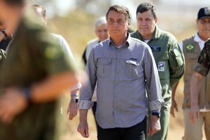 Brazil's President Jair Bolsonaro arrives to attend the annual military exercises by the Navy, Army and Air Force, in Formosa, Brazil, Monday, Aug. 16, 2021. (AP Photo/Eraldo Peres)
