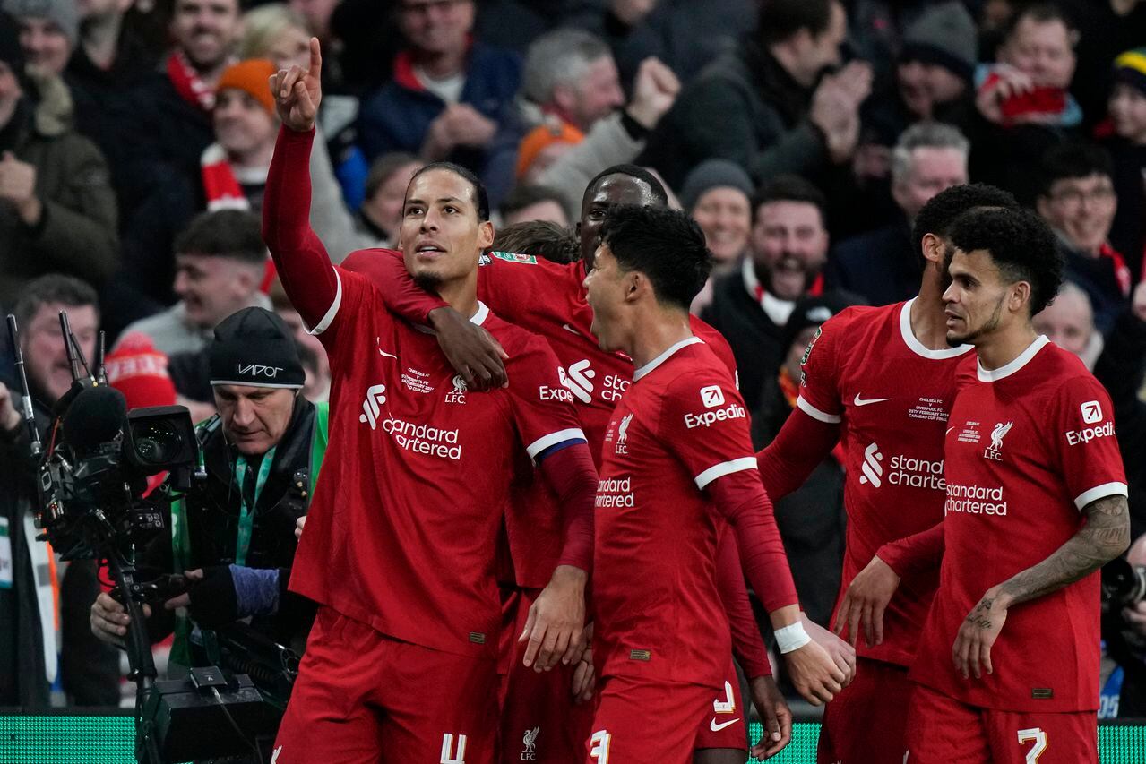 Liverpool's Virgil van Dijk celebrates scoring a goal that was disallowed during the English League Cup final soccer match between Chelsea and Liverpool at Wembley Stadium in London, Sunday, Feb. 25, 2024. (AP Photo/Alastair Grant)