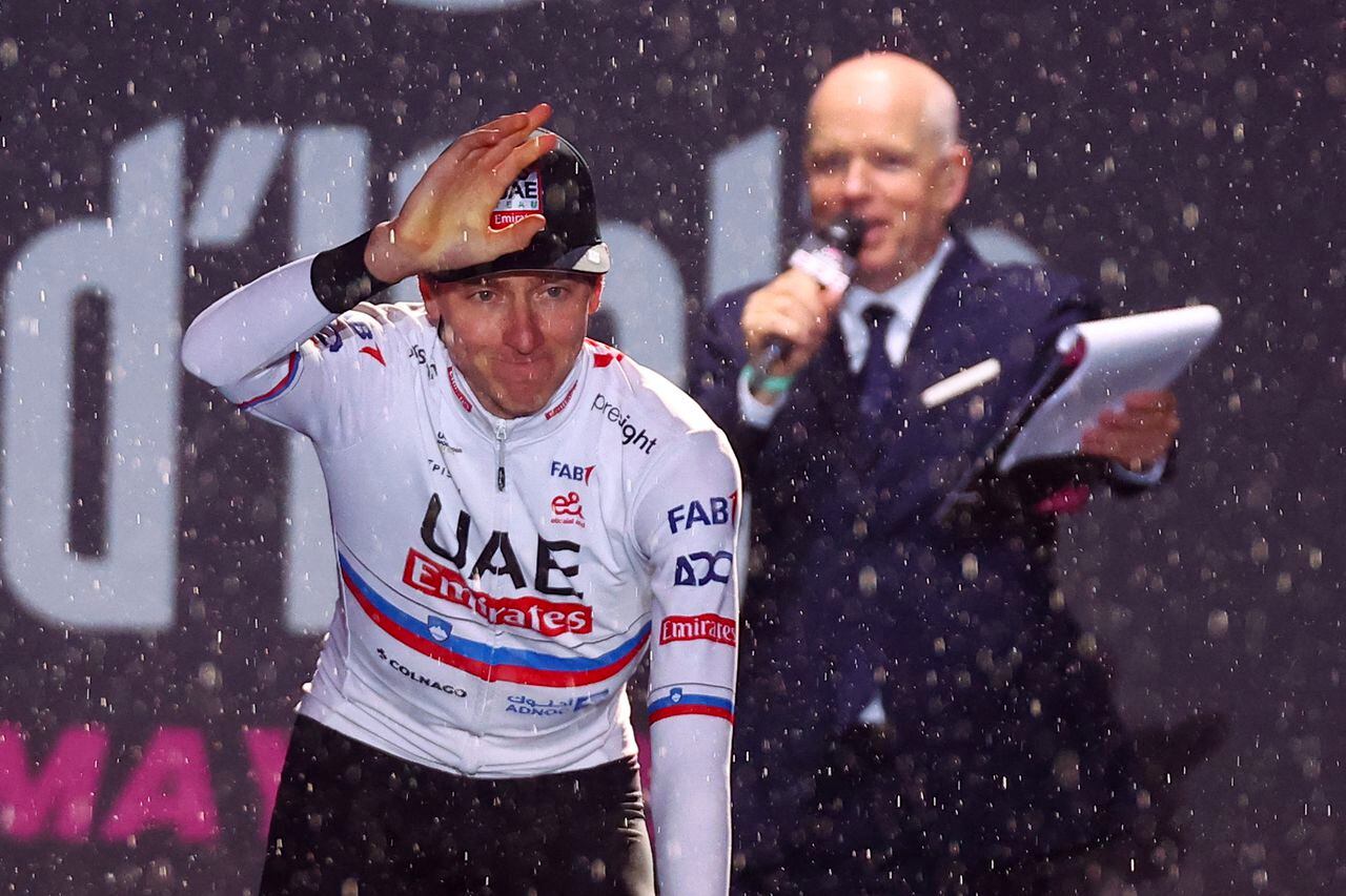 Team UAE's Slovenian rider Tadej Pogacar waves on stage during the opening ceremony and team presentation in Turin, on May 2, 2024, two days before the departure of the Giro d'Italia 2023 cycling race. The Giro d'Italia 2024 cycling race will depart from Venaria Reale near Turin on May 4, and finish in Rome on May 26. (Photo by Luca BETTINI / AFP)