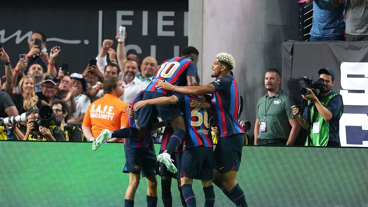 Jul 23, 2022; Las Vegas, Nevada, USA; Barcelona players celebrate a goal scored by midfielder Raphael Dias (22) during a game against Real Madrid at Allegiant Stadium. Mandatory Credit: Stephen R. Sylvanie-USA TODAY Sports