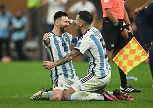 Soccer Football - FIFA World Cup Qatar 2022 - Final - Argentina v France - Lusail Stadium, Lusail, Qatar - December 18, 2022  Argentina's Lionel Messi celebrates with Leandro Paredes after winning the World Cup REUTERS/Dylan Martinez