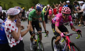 Colombia's Rigoberto Uran, right, and Belgium's Wout Van Aert, wearing the best sprinter's green jersey, climb during the ninth stage of the Tour de France cycling race over 193 kilometers (119.9 miles) with start in Aigle, Switzerland and finish in Chatel les Portes du Soleil, France, Sunday, July 10, 2022. (AP/Thibault Camus)
