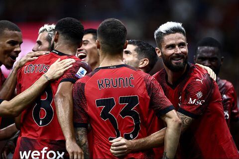 AC Milan's French forward Olivier Giroud (R) celebrates with teammates after scoring during the Italian Serie A football match AC Milan vs Torino on August 26, 2023 at the �San Siro Stadium� in Milan. (Photo by MARCO BERTORELLO / AFP)