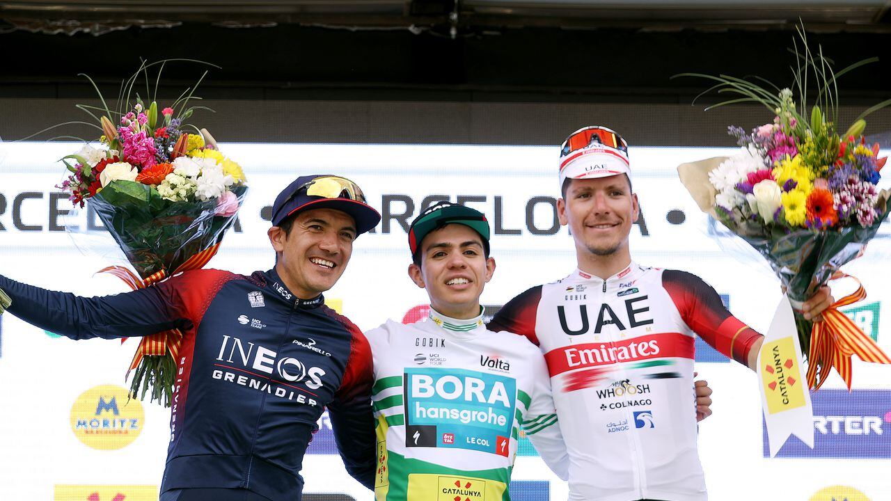 BARCELONA, SPAIN - MARCH 27: (L-R) Richard Carapaz of Ecuador and Team INEOS Grenadiers on second place, stage winner Sergio Andres Higuita Garcia of Colombia and Team Bora - Hansgrohe green leader jersey and João Almeida of Portugal and UAE Team Emirates on third place, pose on the podium during the podium ceremony after the 101st Volta Ciclista a Catalunya 2022 - Stage 7 a 138,7km stage from Barcelona to Barcelona / #VoltaCatalunya101 / #WorldTour / on March 27, 2022 in Barcelona, Spain. (Photo by Gonzalo Arroyo Moreno/Getty Images)
