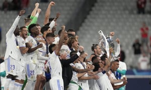 Real Madrid's Marcelo, center right, lifts the trophy after winning the Champions League final soccer match between Liverpool and Real Madrid at the Stade de France in Saint Denis near Paris, Saturday, May 28, 2022. Real Madrid defeated Liverpool 1-0. (AP Photo/Kirsty Wigglesworth)