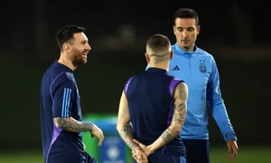 DOHA, QATAR - NOVEMBER 25: Lionel Messi of Argentina reacts with Lionel Scaloni, Head Coach of Argentina, during the Argentina MD-1 training session at Qatar University on November 25, 2022 in Doha, Qatar. (Photo by Robert Cianflone/Getty Images)