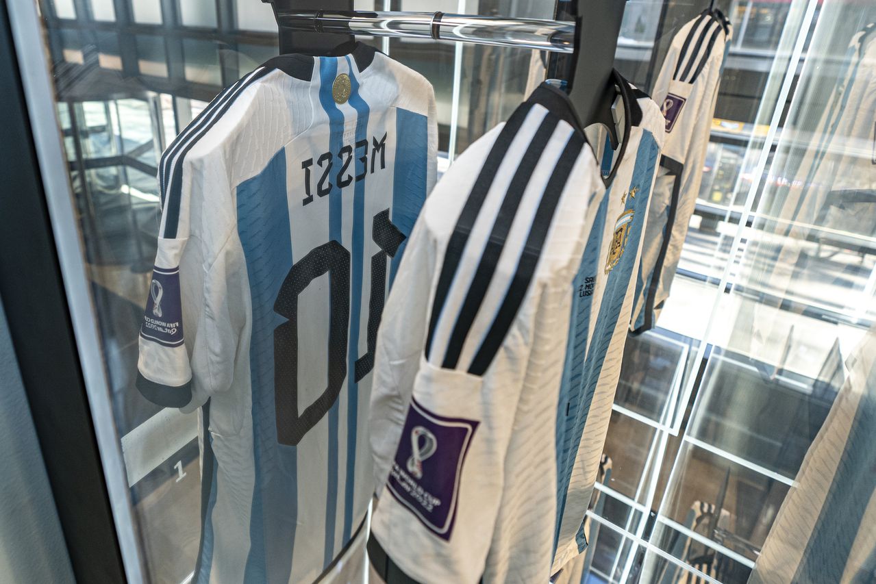 A shirt, worn by soccer player Lionel Messi in a match for Argentina against Saudi Arabia in the 2022 FIFA World Cup, is display at Sotheby's, Thursday, Nov. 30, 2023, in New York. Six jerseys worn by Messi during Argentina’s winning run at last year’s World Cup have sold for $7.8 million. The auction house Sotheby's final price for the shirts is the highest price for an item of sports memorabilia this year, Sotheby’s said, Thursday, Dec. 14, 2023. (AP Photo/Peter K. Afriyie, File)
