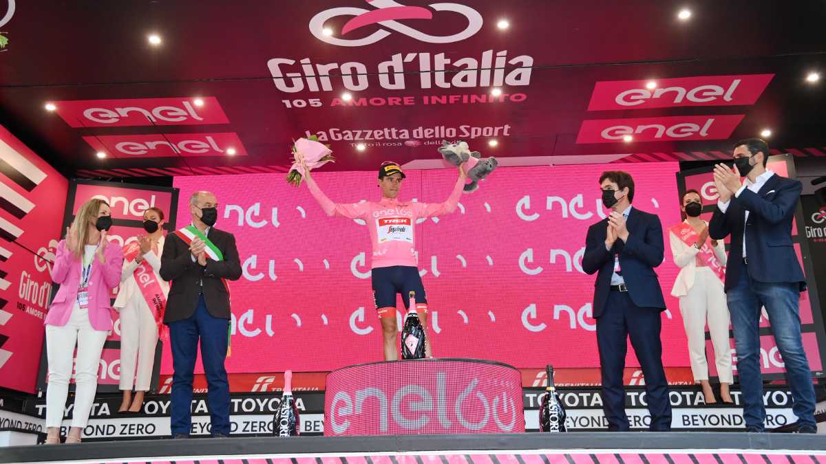 Spain's Juan Pedro Lopez Perez celebrates on the podium as he wears the pink jersey of the overall leader at the end of the 10th stage of the Giro D'Italia cycling race from Pescara to Jesi, Italy, Tuesday, May 17, 2022. (Gian Mattia D'Alberto/LaPresse vía AP)