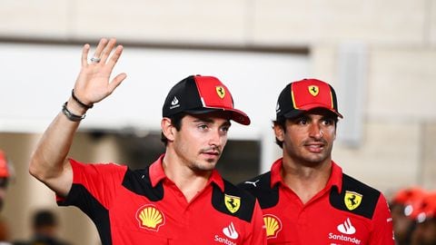 LUSAIL CITY, QATAR - OCTOBER 08: Charles Leclerc of Monaco and Ferrari and Carlos Sainz of Spain and Ferrari look on from the drivers parade prior to the F1 Grand Prix of Qatar at Lusail International Circuit on October 08, 2023 in Lusail City, Qatar. (Photo by Clive Mason - Formula 1/Formula 1 via Getty Images)