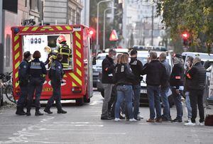 Security and emergency personnel are on October 31, 2020 in Lyon at the scene where an attacker armed with a sawn-off shotgun wounded an Orthodox priest in a shooting before fleeing, said a police source. - The priest, who has Greek nationality, was closing his church when the attack happened and is now in a serious condition, said the source, who asked not to be named. The shooting comes three days after three people were killed in a knife rampage inside a church in the southern town of Nice as France was already on edge after the republication in early September of cartoons of the prophet Mohammed by the Charlie Hebdo weekly, and the beheading of a teacher. (Photo by PHILIPPE DESMAZES / AFP)