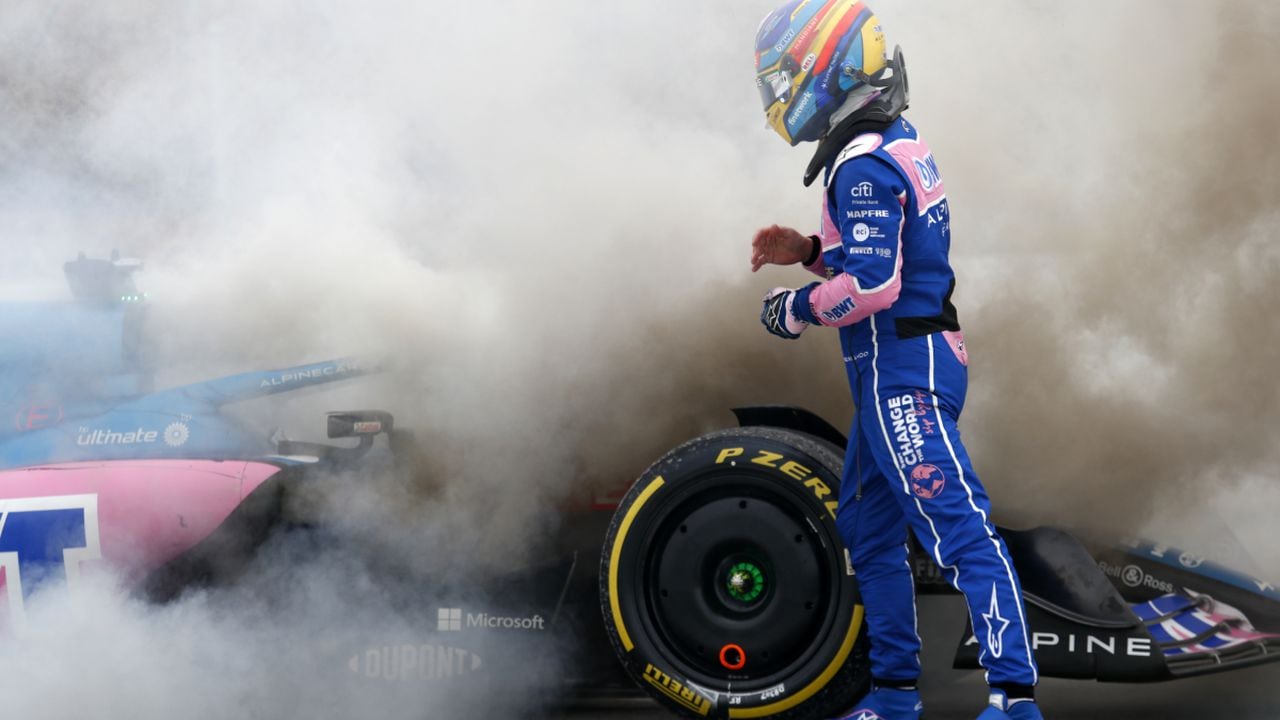 Alpine driver Fernando Alonso of Spain gets out of his car during a Formula One pre-season testing session at the Catalunya racetrack in Montmelo, just outside of Barcelona, Spain, Friday, Feb. 25, 2022. (AP/Joan Monfort)