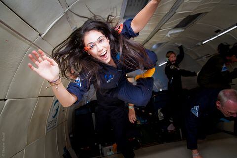 In this undated handout photo provided by Virgin Galactic to AFP on June 3, 2021, researcher for the International Institute for Astronautical Sciences (IIAS), Kellie Gerardi, experiances weightlessness on a Zero Gravity plane. - The space tourism company Virgin Galactic announced that 32-year-old researcher, Kellie Gerardi, who also has a large TikTok following, would be sent into space to conduct experiments for a few minutes in weightlessness. (Photo by Steve BOXALL / AFP) / RESTRICTED TO EDITORIAL USE - MANDATORY CREDIT "AFP PHOTO / Virgin Galactic/ STEVE BOXALL" - NO MARKETING - NO ADVERTISING CAMPAIGNS - DISTRIBUTED AS A SERVICE TO CLIENTS
