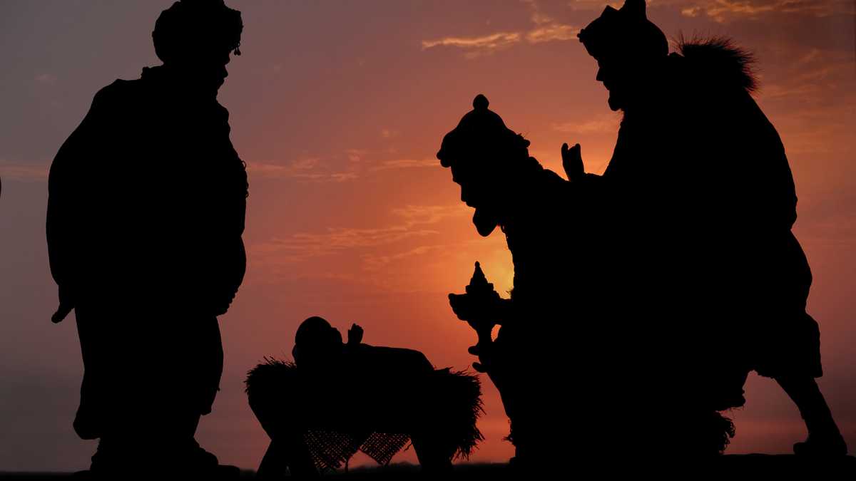 A photographed Silhouette of the Three Kings and Jesus against a sunset sky.  (not an illustration).PLEASE CLICK ON THE IMAGE BELOW TO SEE MY LIGHTBOX CONTAINING ALL OF MY SILHOUETTE IMAGES:
