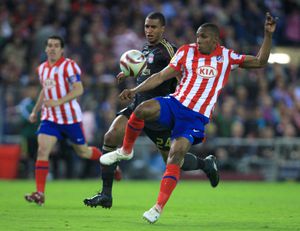 Liverpool's David Ngog (left) and Atletico Madrid's Luis Amaranto Perea (right) in action   (Photo by Adam Davy - PA Images via Getty Images)