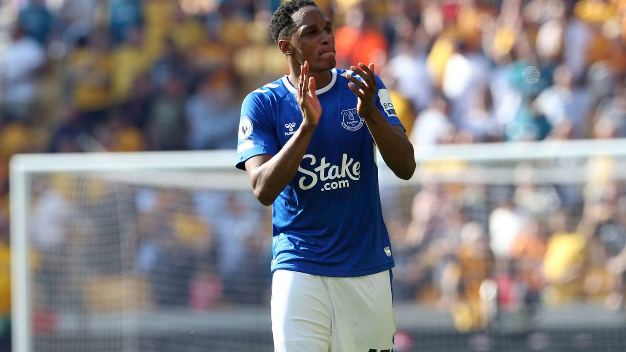 Everton's Yerry Mina applauds the fans after the English Premier League soccer match between Wolverhampton Wanderers and Everton at the Molineux Stadium, Wolverhampton, Saturday May 20, 2023. (Barrington Coombs/PA via AP)