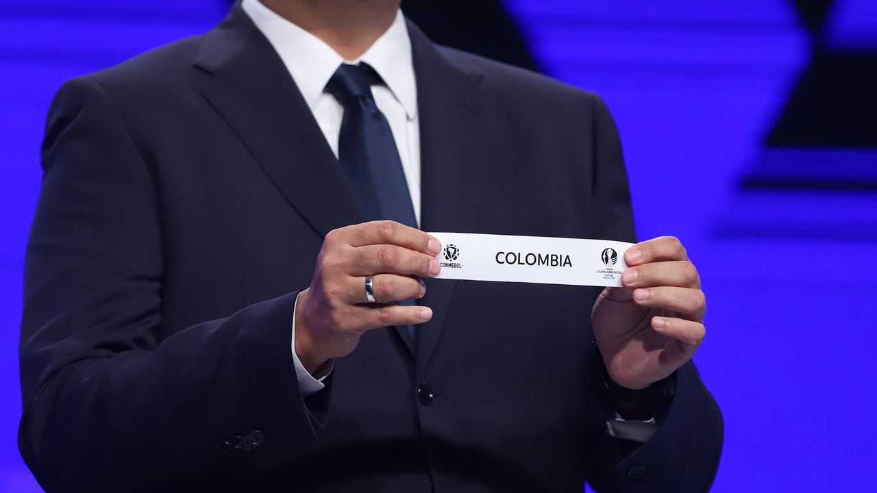 ASUNCION, PARAGUAY - DECEMBER 20: Fred Nantes Director of Clubs Competitions draws out the card of Colombia during the Copa America Futsal 2022 draw on December 20, 2021 in Asuncion, Paraguay. (Photo by Nathalia Aguilar - Pool/Getty Images)