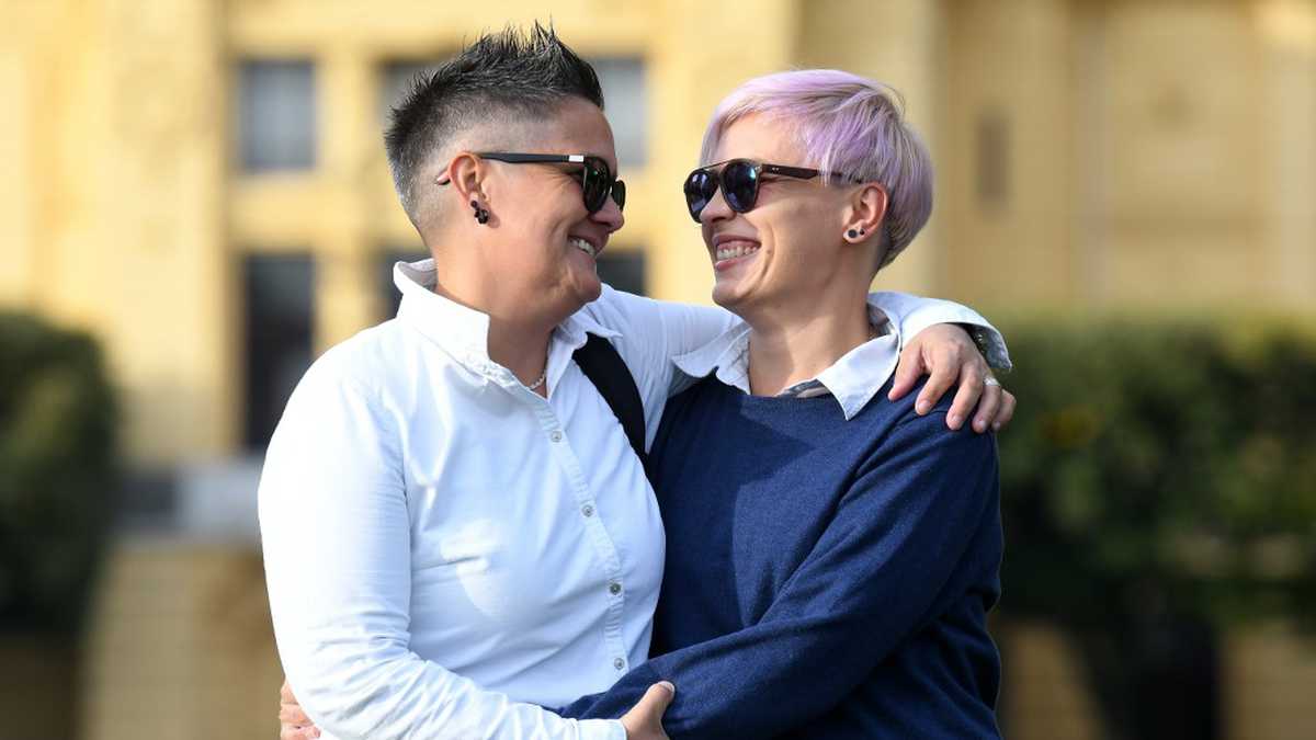 Lovers and former nuns Marita Radovanovic (R) and Fanika Feric, called "Fani" pose for a photograph on October 09, 2020, in Zagreb. - Marita was a young nun on a Croatian island when she first met Fani, a fellow sister who would become her great love. "I simply followed my heart," the 36-year-old says of their story -- the subject of a new, bold documentary in the staunchly Catholic country, where LGBTQ rights are restricted. Titled 'Nun of Your Business', the film premiered at the ZagrebDox international film festival over the weekend, scooping up an audience award. (Photo by DENIS LOVROVIC / AFP)