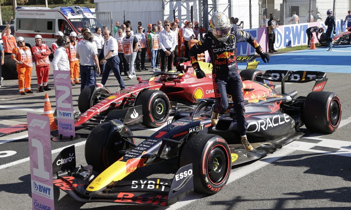 Red Bull driver Max Verstappen of the Netherlands jumps from his car after winning the Italian Grand Prix race at the Monza racetrack, in Monza, Italy, Sunday, Sept. 11, 2022. (AP/Ciro De Luca, Pool)