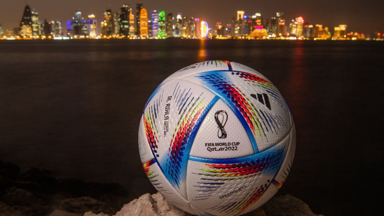 DOHA, QATAR - MARCH 31: In this photo illustration an official FIFA World Cup Qatar 2022 ball sits on display in front of the skyline of Doha ahead of the FIFA World Cup Qatar 2022 draw on March 31, 2022 in Doha, Qatar. (Photo by Getty Images/David Ramos)