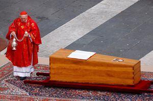 Cardinal Giovanni Battista Re blesses the coffin of former Pope Benedict, in St. Peter's Square at the Vatican, January 5, 2023. REUTERS/Guglielmo Mangiapane