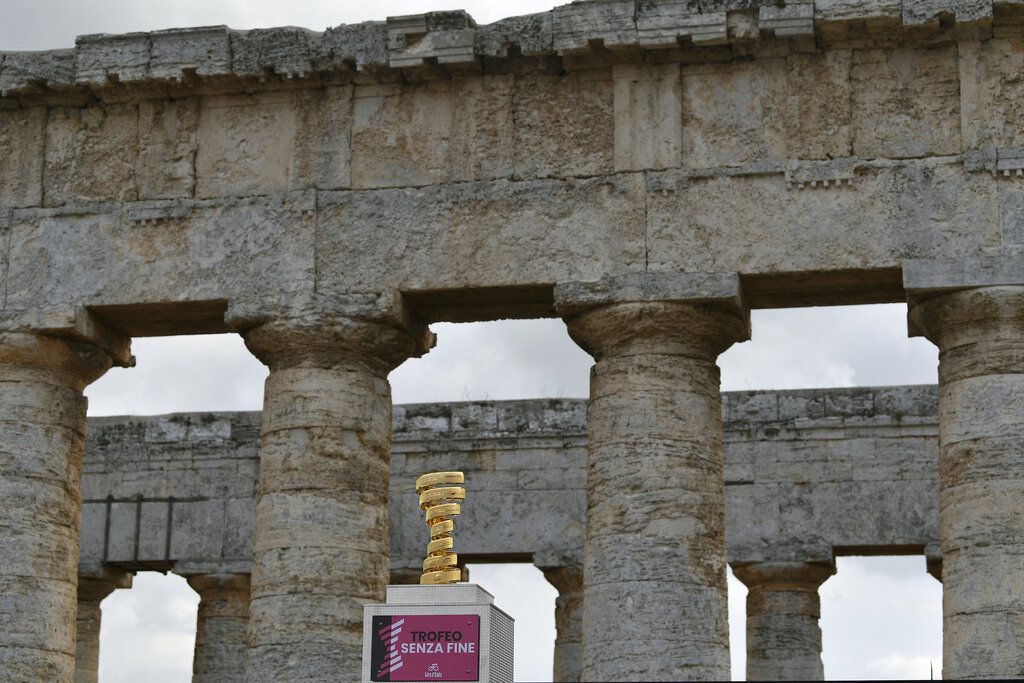 The trophy of the Giro d'Italia (Tour of Italy) cycling race is displayed at the Segesta archaeological park, Sicily, Italy, Thursday, Oct. 1, 2020. The race will begin with a 16-kilometer (10-mile) individual time trial from Monreale to Palermo on Oct. 3. This year’s Giro was originally scheduled to start with three stages in Hungary and run from May 9-31 but it was postponed because of the coronavirus pandemic. (Fabio Ferrari/LaPresse via AP)