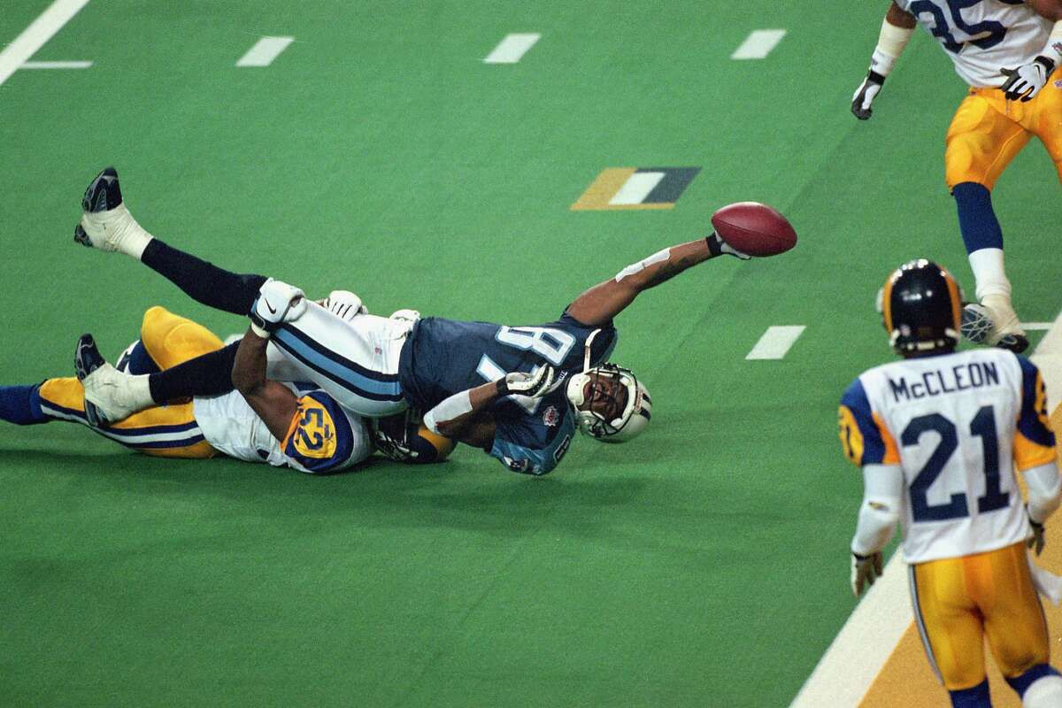 TLANTA - JANUARY 30: Kevin Dyson #87 of the Tennessee Titans reaches for the end zone with the ball as Mike Jones #52 of the St. Louis Rams tackles him on the last play of the game during the Super Bowl XXXIV Game at the Georgia Dome on January 30, 2000 in Atlanta, Georgia. The Rams defeated the Titans 23-16. (Photo by: Tom Hauck /Getty Images)