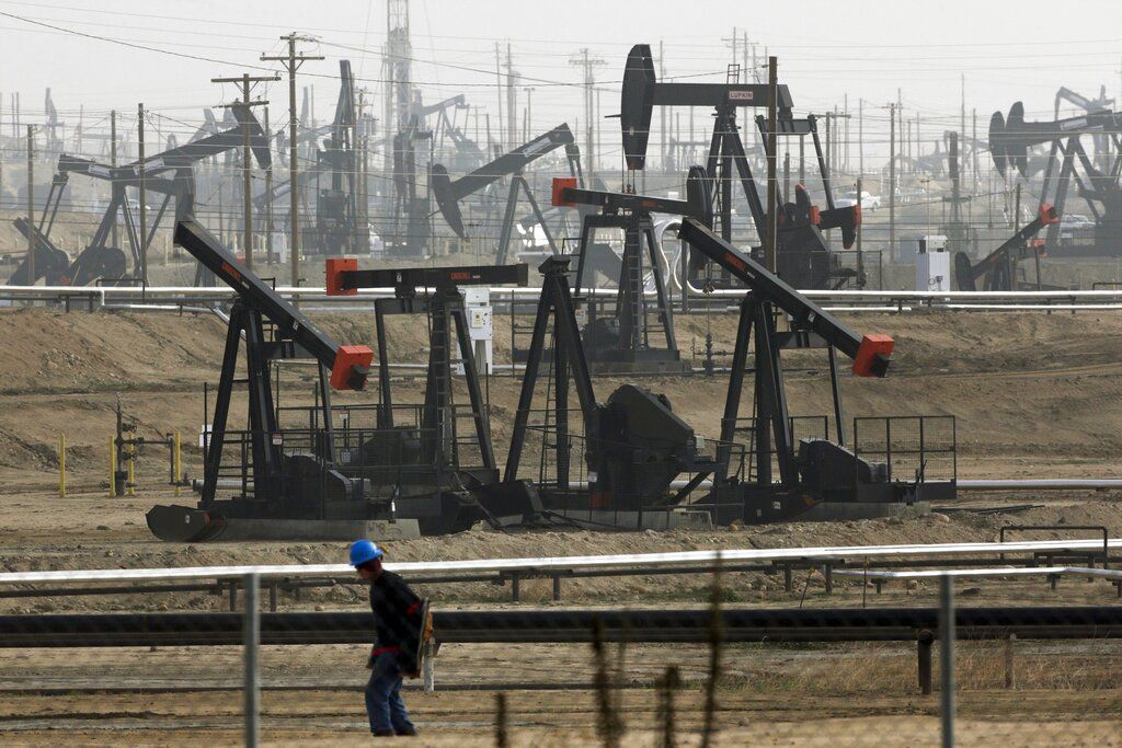 FILE - In this Jan. 16, 2015, file photo, pumpjacks are seen operating in Bakersfield, Calif. Last year, California Gov. Gavin Newsom called on the state Legislature to ban fracking by 2024. On Wednesday, Feb. 17, 2021, state Sen. Scott Wiener, a Democrat from San Francisco, introduced legislation that would ban the issuance or renewal of fracking permits starting on Jan. 1, 2022. The bill would also ban all fracking in California, along with other forms of oil extraction such as cyclic steaming, by Jan. 1, 2027. (AP Photo/Jae C. Hong, File)