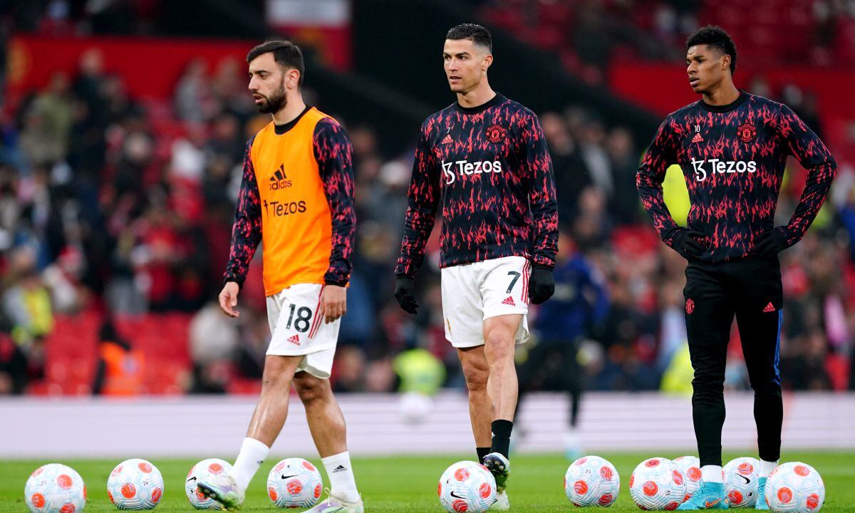 Manchester United's Bruno Fernandes, Cristiano Ronaldo and Marcus Rashford warm up on the pitch ahead of the Premier League match at Old Trafford, Manchester. Picture date: Thursday April 28, 2022. (Photo by Getty Images/Martin Rickett/PA Images)
