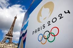 PARIS, FRANCE - APRIL 21: The Paris 2024 logo, representing the Olympic Games is displayed near the Eiffel Tower three  months prior to the start of the Paris 2024 Olympic and Paralympic games on April 21, 2024 in Paris, France. The city is gearing up to host the XXXIII Olympic Summer Games, from 26 July to 11 August. (Photo by Chesnot/Getty Images)