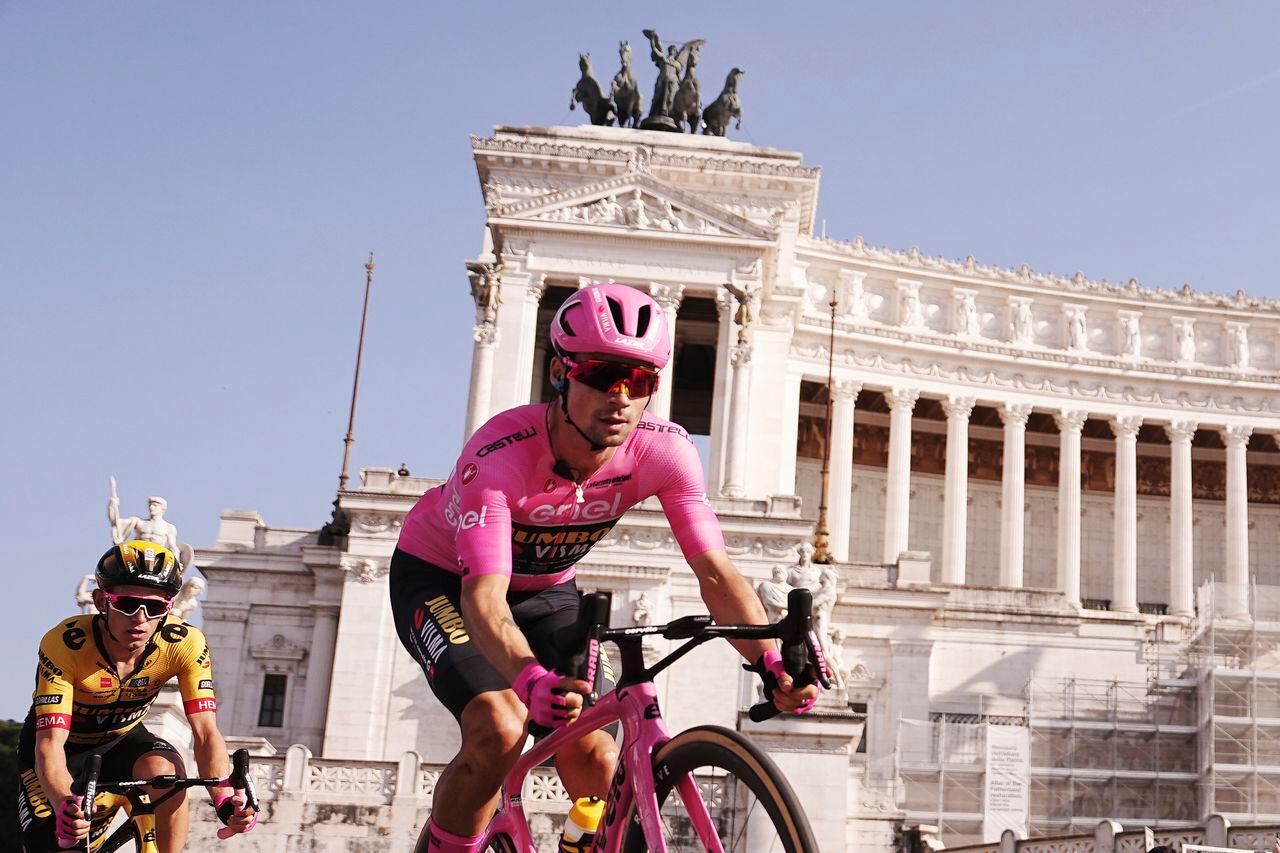 Slovenia's Primoz Roglic, wearing the pink jersey of the race overall leader, pedals past the Unknown Soldier monument during the last stage of the Giro d'Italia cycling race, in Rome, Sunday, May 28, 2023. (Marco Alpozzi/LaPresse via AP)