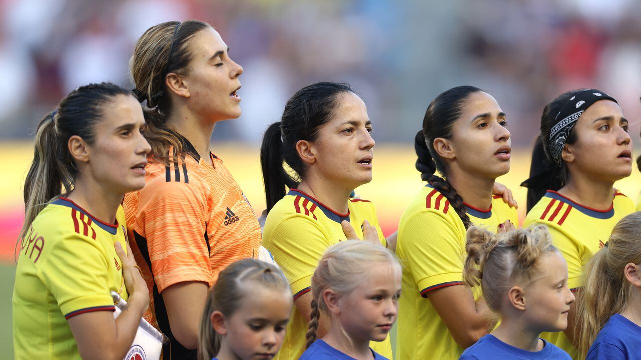 SANDY, UT - JUNE 28: Daniela Montoya #6 of Colombia (L) and her teammates stand for their national anthem before to the friendly game between Colombia and United States at Rio Tinto Stadium on June 28, 2022 in Sandy, Utah. (Photo by Omar Vega/Getty Images)