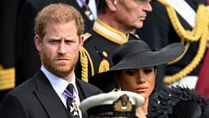 Britain's Meghan, Duchess of Sussex, reacts as she and Prince Harry, Duke of Sussex, attend the state funeral and burial of Britain's Queen Elizabeth, in London, Britain, September 19, 2022 REUTERS/Toby Melville