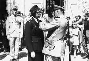 (FILES) In this file photo taken on August 19, 1961 US-born singer-entertainer Joséphine Baker (C left) receives the Legion of Honor and the Croix de Guerre with palm in her Milandes Castle. - The Franco-American artist Josephine Baker will become the sixth woman to enter the Pantheon on November 30, 2021. (Photo by - / AFP)