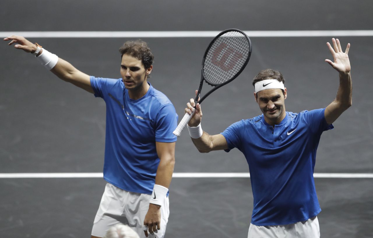 FILE - Europe's Rafael Nadal, left, and Roger Federer, right, celebrate after defeating World's Jack Sock and Sam Querrey in their Laver Cup doubles tennis match against in Prague, Czech Republic, Saturday, Sept. 23, 2017. Roger Federer and Rafael Nadal will team up in doubles at the Laver Cup on Friday, Sept. 23, 2022, in what Federer has announced will be the final match of his long and illustrious career. (AP Photo/Petr David Josek, File)