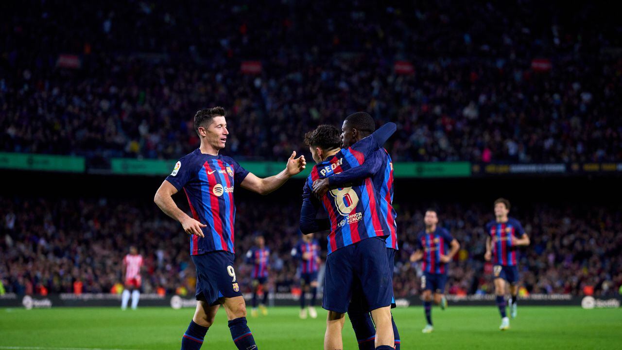 BARCELONA, SPAIN - NOVEMBER 05: Ousmane Dembele of FC Barcelona celebrates with Robert Lewandowski and Pedro Gonzalez 'Pedri' after scoring their team's first goal during the LaLiga Santander match between FC Barcelona and UD Almeria at Spotify Camp Nou on November 05, 2022 in Barcelona, Spain. (Photo by Alex Caparros/Getty Images)