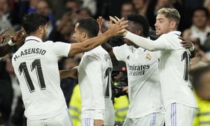 Real Madrid's Lucas Vazquez, second from left, celebrates with teammates after scoring his side's second goal during the Spanish La Liga soccer match between Real Madrid and Sevilla at the Santiago Bernabeu stadium in Madrid, Saturday, Oct. 22, 2022. (AP Photo/Manu Fernandez)