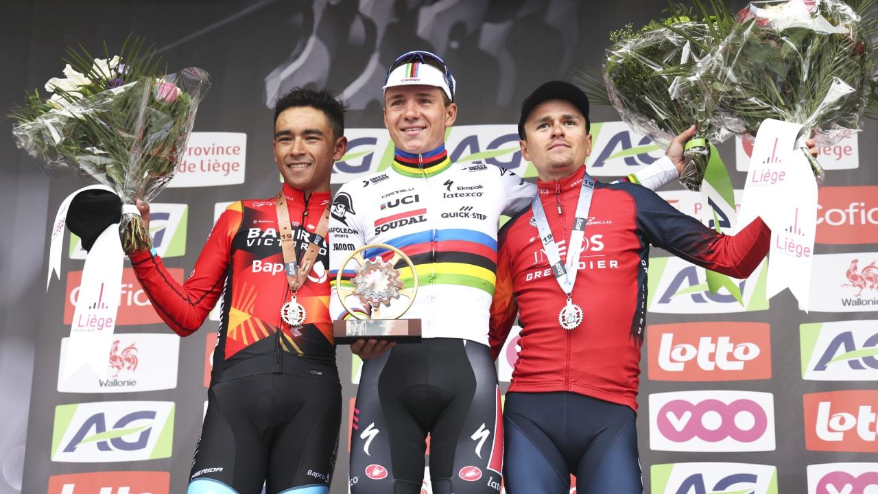 First place, Belgium's Remco Evenepoel of the Soudal Quick Step, center, poses on the podium with second place Britain's Thomas Pidcock of the INEOS Grenadiers, right, and third place, Colombia's Santiago Buitrago of the Bahrain Victorious during the Belgian cycling classic and UCI World Tour race Liege Bastogne Liege, in Liege, Belgium, Sunday, April 23, 2023. (AP/Geert Vanden Wijngaert)