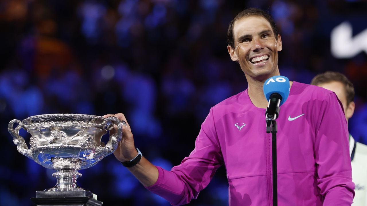 Rafael Nadal of Spain gestures with the Norman Brookes Challenge Cup after defeating Daniil Medvedev of Russia in the men's singles final at the Australian Open tennis championships in Melbourne, Australia, early Monday, Jan. 31, 2022. (AP/Hamish Blair)