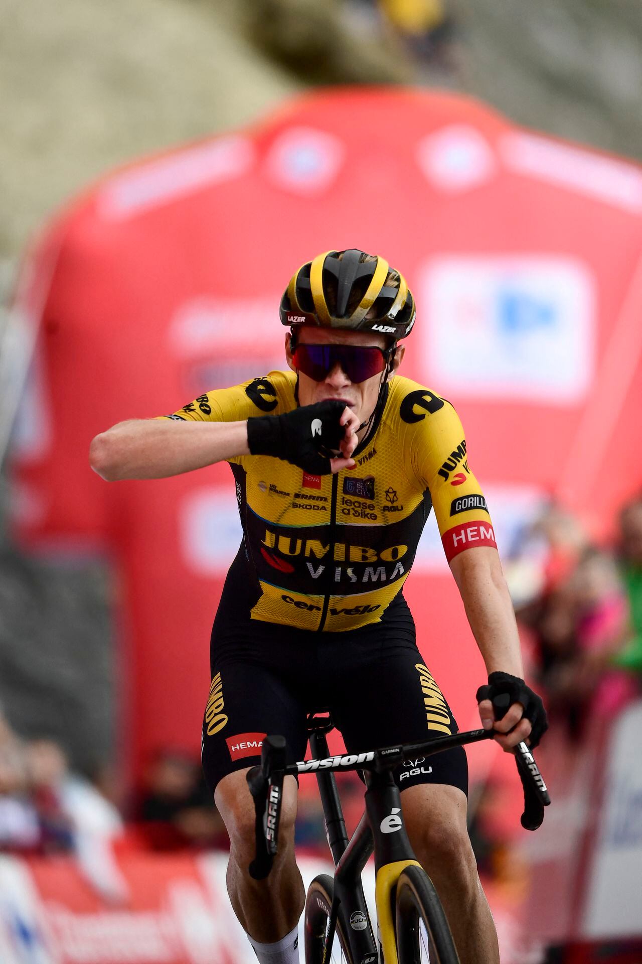 Team Jumbo-Visma's Danish rider Jonas Vingegaard celebrates winning in the stage 13 of the 2023 La Vuelta cycling tour of Spain, a 134,7 km race between Formigal and the Col du Tourmalet in France, on September 8, 2023. (Photo by ANDER GILLENEA / AFP)