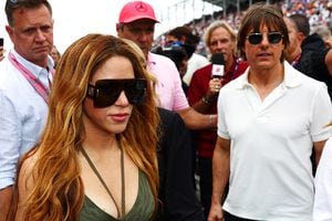 MIAMI, FLORIDA - MAY 07: Shakira and Tom Cruise walk on the grid prior to the F1 Grand Prix of Miami at Miami International Autodrome on May 07, 2023 in Miami, Florida. (Photo by Dan Istitene - Formula 1/Formula 1 via Getty Images)