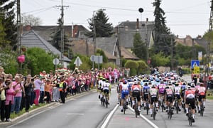 Cyclists pedal past cheering fans during the opening stage of the Giro d'Italia cycling race, from Budapest to Visegrad, Hungary, Friday, May 6, 2022. (Fabio Ferrari/LaPresse via AP)