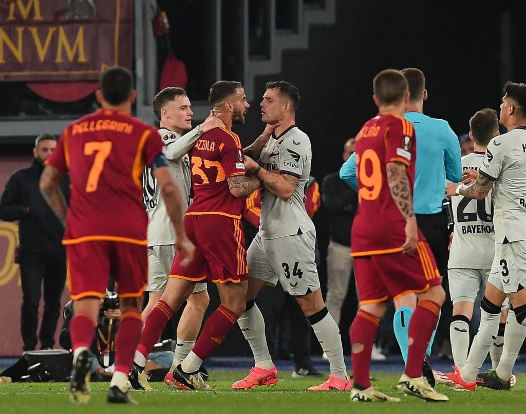 ROME, ITALY - MAY 02: Granit Xhaka of Bayer 04 Leverkusen argues with Leonardo Spinazzola of AS Roma  during the UEFA Europa League 2023/24 Semi-Final first leg match between AS Roma and Bayer 04 Leverkusen at Stadio Olimpico on May 02, 2024 in Rome, Italy. (Photo by Silvia Lore/Getty Images) (Photo by Silvia Lore/Getty Images)