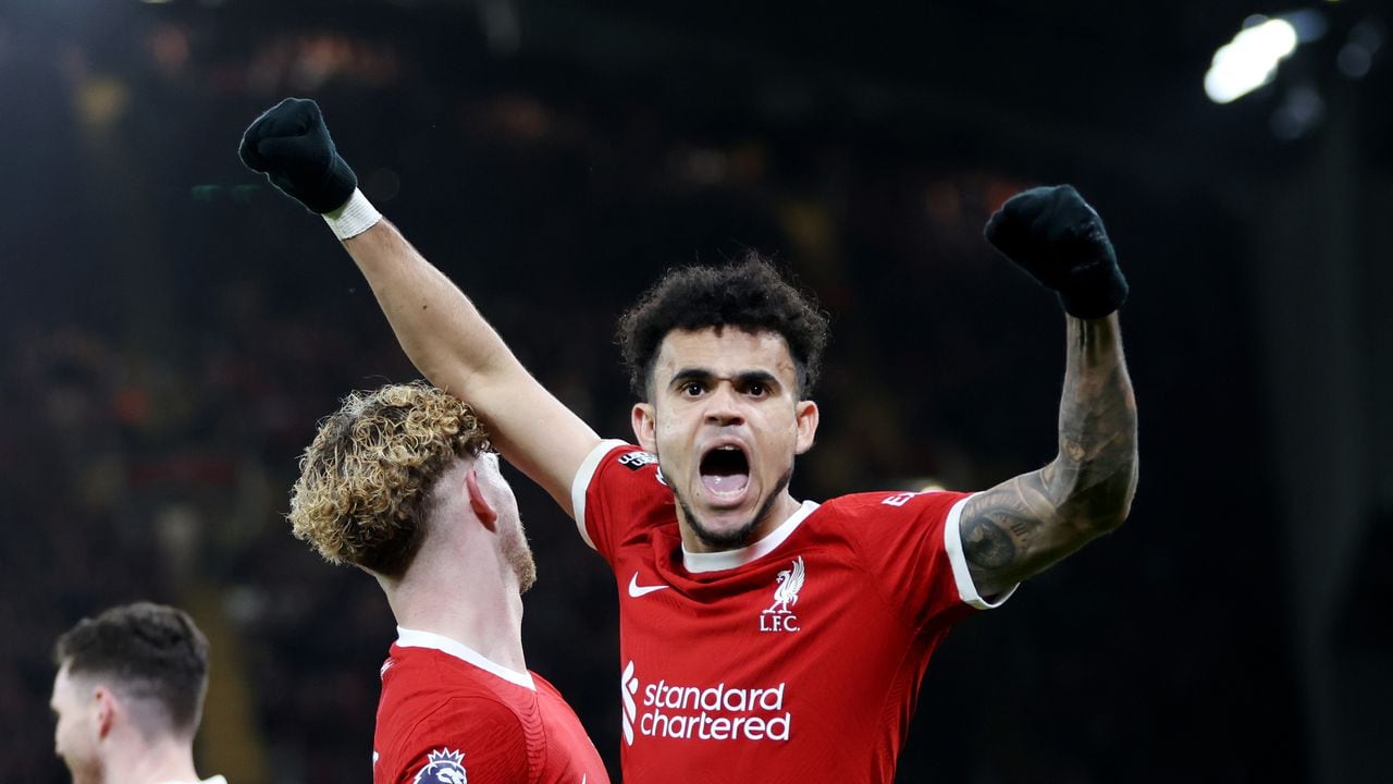 LIVERPOOL, ENGLAND - FEBRUARY 21: Luis Diaz of Liverpool celebrates scoring his team's third goal during the Premier League match between Liverpool FC and Luton Town at Anfield on February 21, 2024 in Liverpool, England. (Photo by Clive Brunskill/Getty Images)