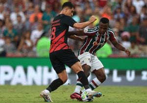 RIO DE JANEIRO, BRAZIL - APRIL 22: Jhon Arias of Fluminense fights for the ball with Vitor Bueno of Athletico Paranaense during the match between Fluminense and Athletico Paranaense as part of Brasileirao 2023 at Maracana Stadium on April 22, 2023 in Rio de Janeiro, Brazil. (Photo by Buda Mendes/Getty Images)