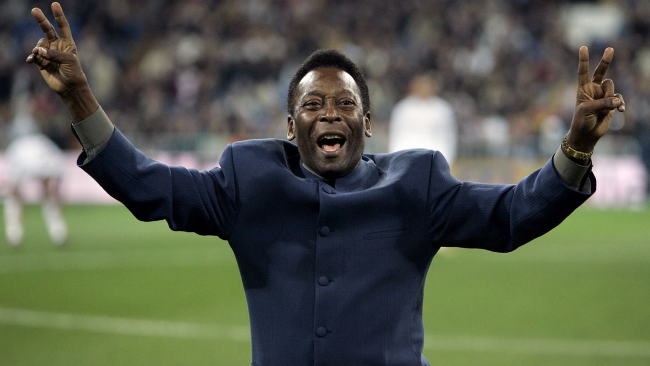 FILE - Brazil's soccer legend Pele greets the crowd ahead of a Spanish league soccer match, in the Santiago Bernabeu stadium in Madrid, Jan. 16, 2005. Pelé, the Brazilian king of soccer who won a record three World Cups and became one of the most commanding sports figures of the last century, died in Sao Paulo on Thursday, Dec. 29, 2022. He was 82. (AP/Jasper Juinen, File)