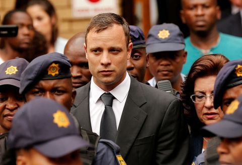 South African Olympic and Paralympic sprinter Oscar Pistorius leaves the North Gauteng High Court in Pretoria October 15, 2014.