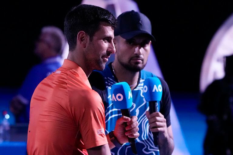 Serbia's Novak Djokovic, left, and Australia's Nick Kyrgios are interviewed following an exhibition match on Rod Laver Arena ahead of the Australian Open tennis championship in Melbourne, Australia, Friday, Jan. 13, 2023. (AP/Mark Baker)