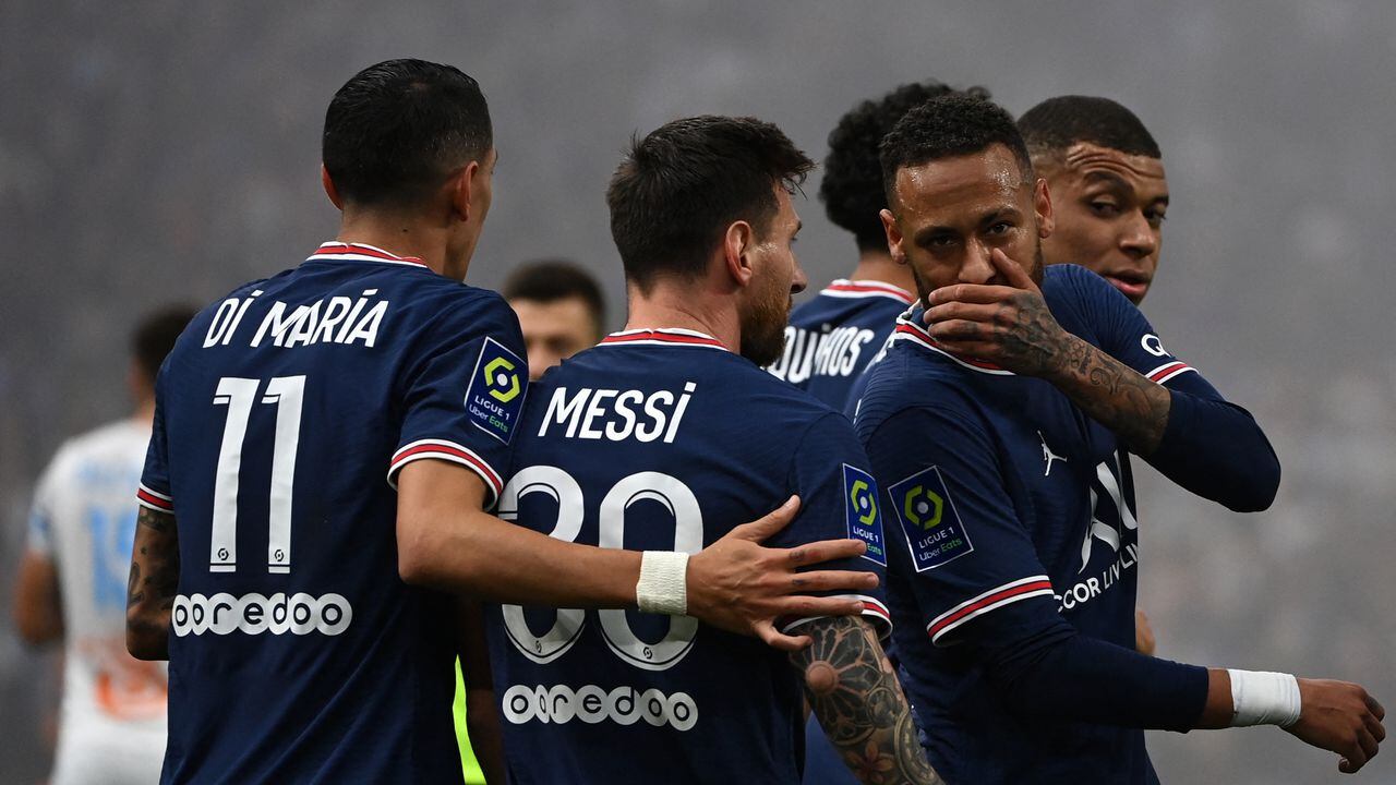 Paris Saint-Germain's Brazilian forward Neymar (2nd R), Paris Saint-Germain's Argentinian forward Lionel Messi (C), di Paris Saint-Germain's Argentinian midfielder Angel Di Maria (L) and Paris Saint-Germain's French forward Kylian Mbappe (R) celebrate a goal that was later invalidated by the video assistant referee (VAR) during the French L1 football match between Olympique Marseille (OM) and Paris Saint-Germain's (PSG) at Stade Velodrome in Marseille, southern France, on October 24, 2021. (Photo by CHRISTOPHE SIMON / AFP)