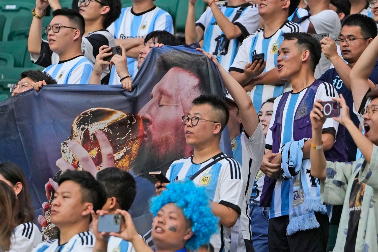 Fans display a large banner of Lionel Messi prior to the start of the international friendly soccer match between Argentina and Australia at the Workers' Stadium in Beijing, China, Thursday, June 15, 2023. (AP Photo/Andy Wong)