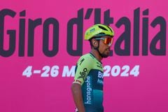 Team Bora's Colombian rider Daniel Martinez stands on stage during the presentation ceremony prior the 5th stage of the 107th Giro d'Italia cycling race, 178 km between Genova and Lucca, on May 8, 2024 in Genova. (Photo by Luca Bettini / AFP)